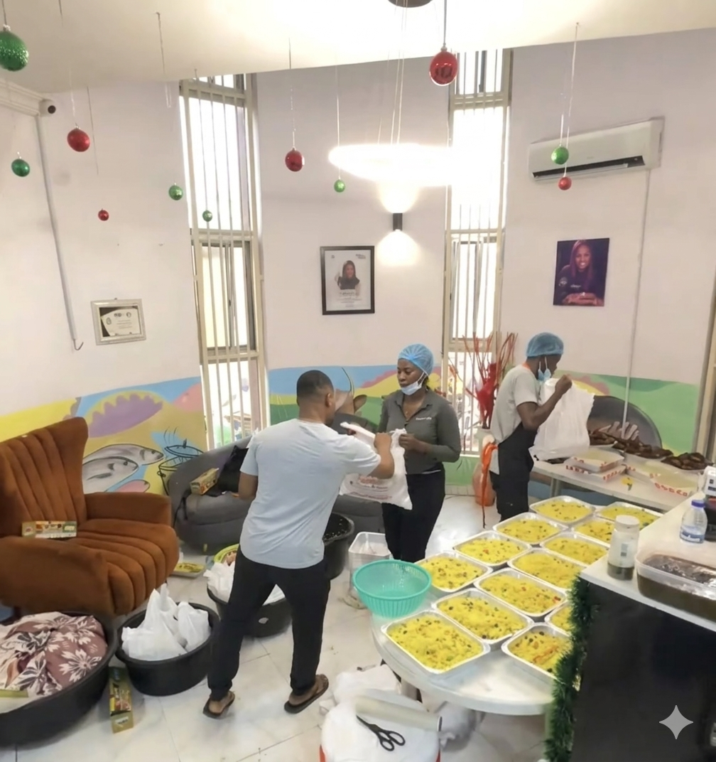 A happy customer enjoying authentic African cuisine from Home Of Tasty Meals in Lagos